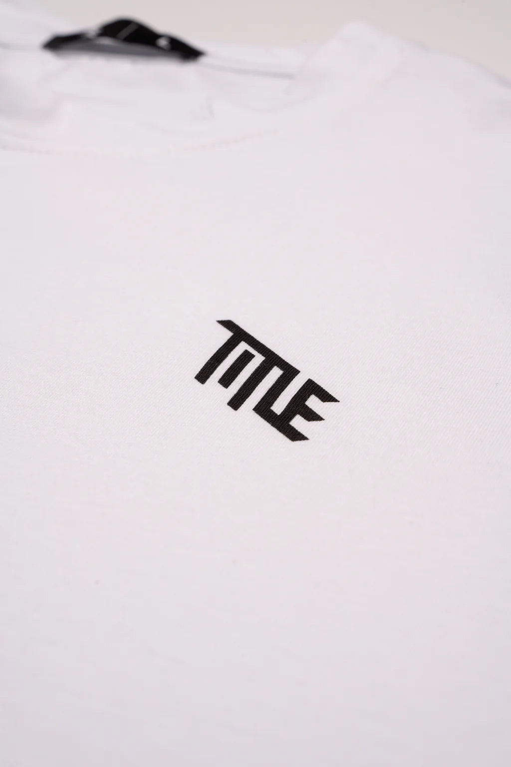 Polera Title Essential SS Blanca